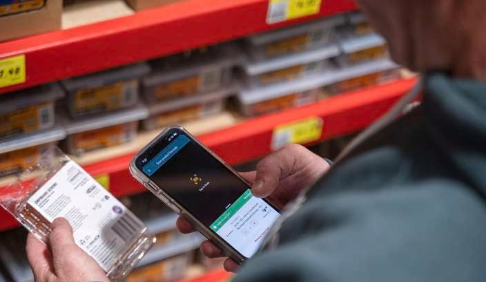 close up of a mobile phone to get a price of a product