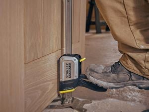 Stanley fat max being used to lift a cabinet