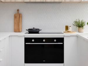 Black oven displayed in modern kitchen display