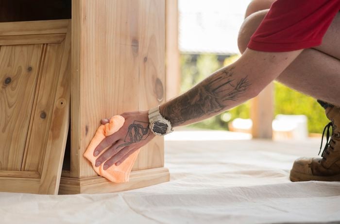 Wiping the furniture with a damp cloth