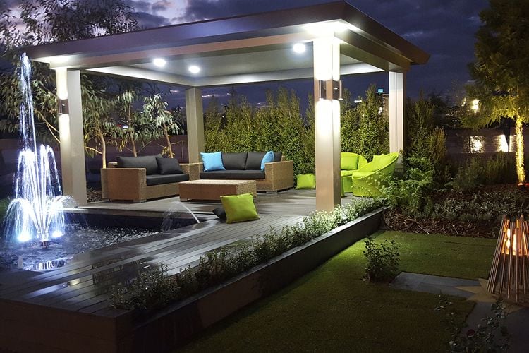 Backyard decking and entertaining space with water fountain