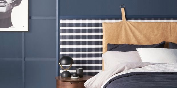 Bedroom with a navy blue colour scheme