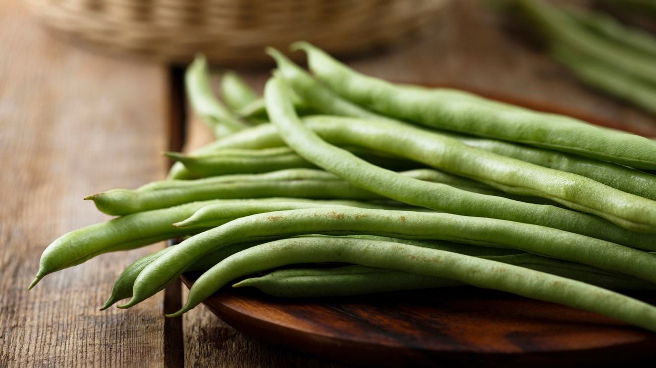 close up of green beans on a cooking board