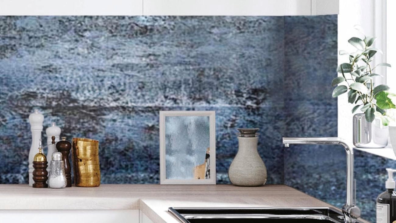 Scandi-style minimal kitchen featuring a blue splashback