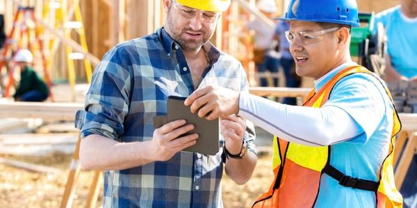 Tradies looking at an iPad.