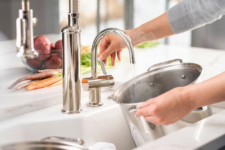 Person filling pot with water