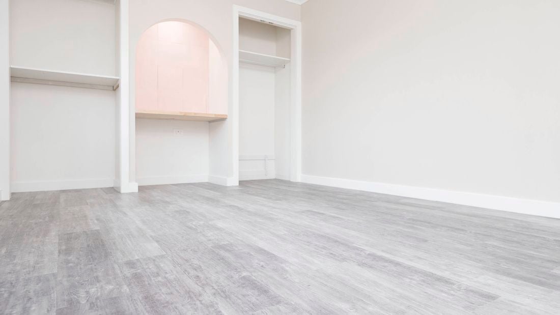 A beautiful room with perfectly laid planks.