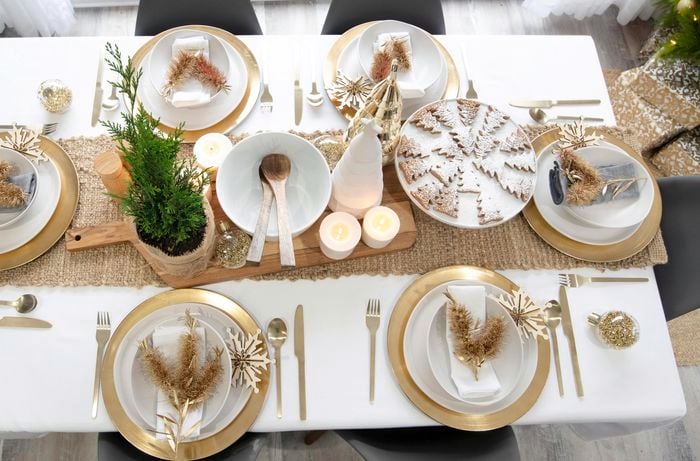 Overhead view of a dining table set and decorated for Christmas