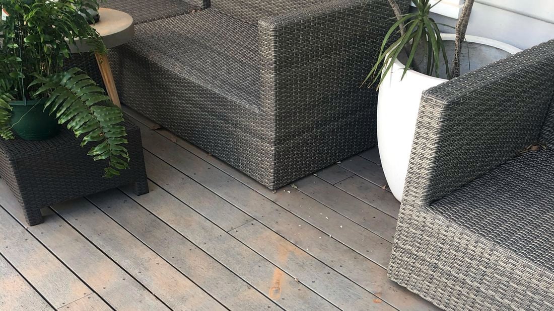 Deck showing patches of red dust