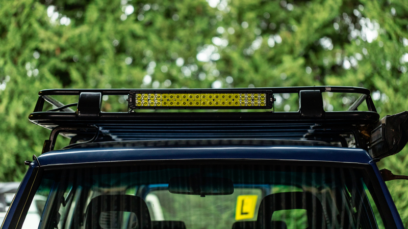 Front view of KT 20'' Double Row LED light bar mounted to roof rack.
