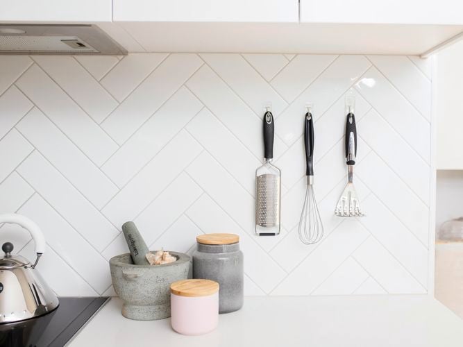 kitchen utensils on a wall