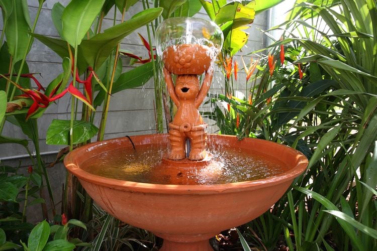 Bird fountain with small statue