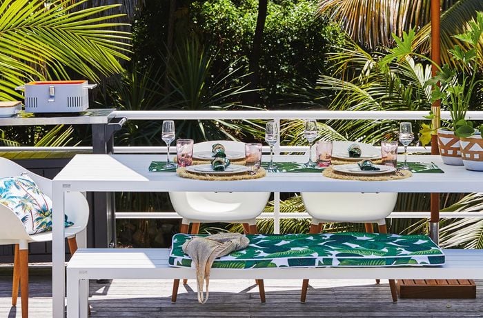 outdoor deck with portable table and barbeque