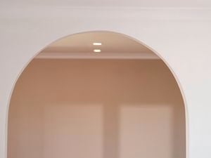 A smooth white plaster arch.