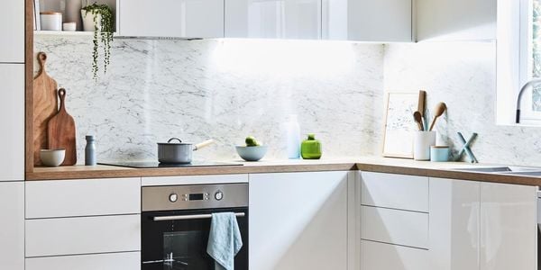 Kitchen with marble and neat appliances