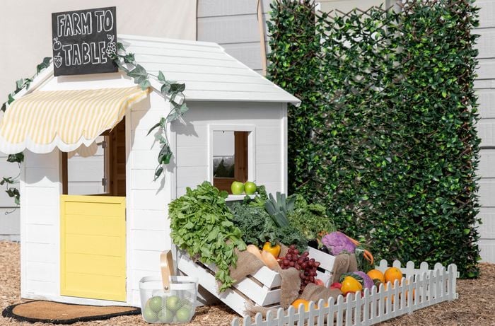 A finished cubby house customised to look like a greengrocer