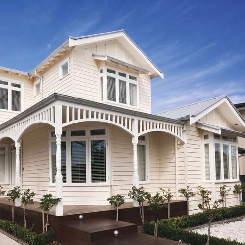 Weatherboard two storey house painted in cabots timbercolour with heritage finishes