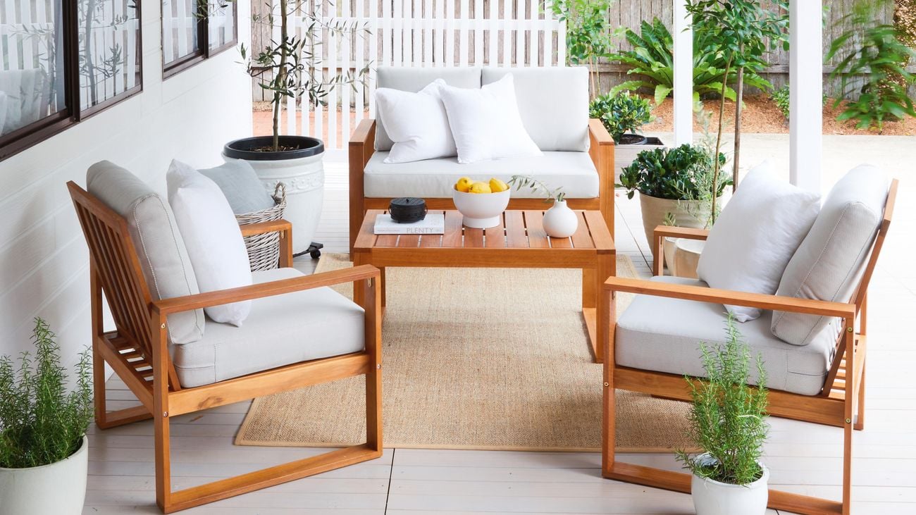 Deck with timber outdoor furniture and potted plants