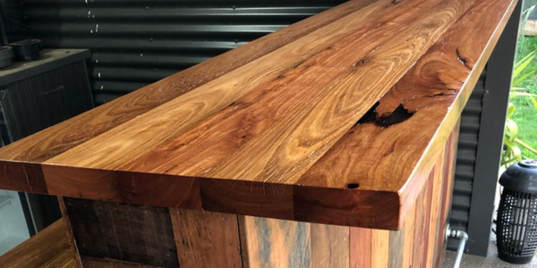 A DIY timber bar in an outdoor room