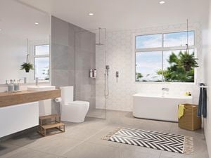 A warmly lit white backroom with wooden countertops, woven basket
