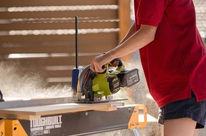 Using a brushless jigsaw to cut MDF board.