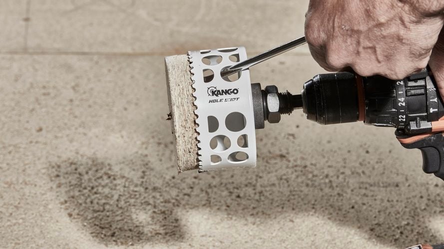 Removing drilled part from holesaw.