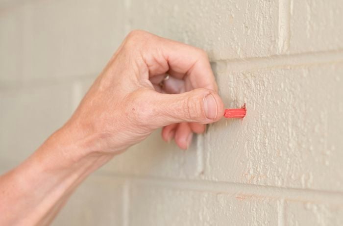 Insert the wall plug in the brick 