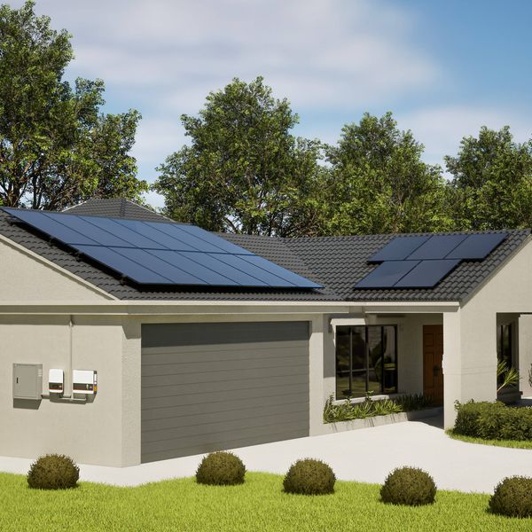 Single-storey home with rooftop solar panels and wall-mounted battery and inverter system, surrounded by landscaped gardens and trees.