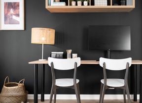 A study nook against a darkly painted wall