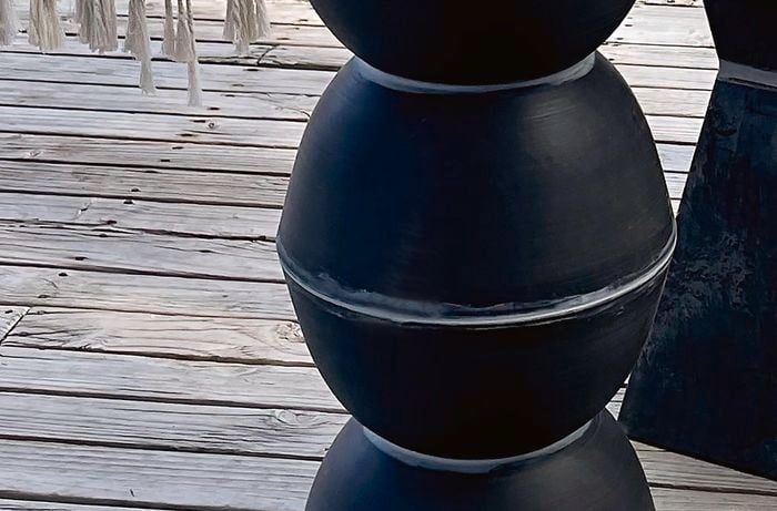 Four planters secured together to create a D.I.Y. plinth