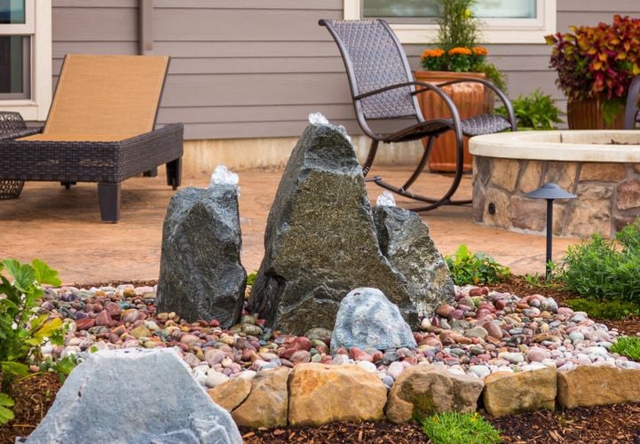Water fountain in stone garden