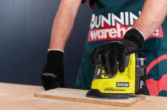 Sanding timber with a electric sander