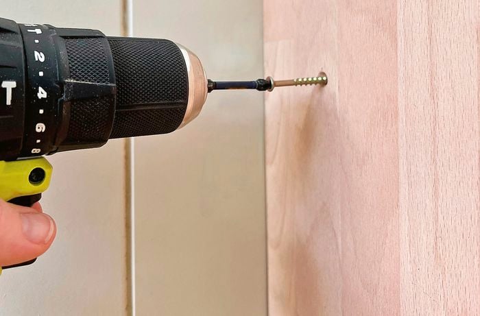 Ryobi cordless drill driver entering side wall panels