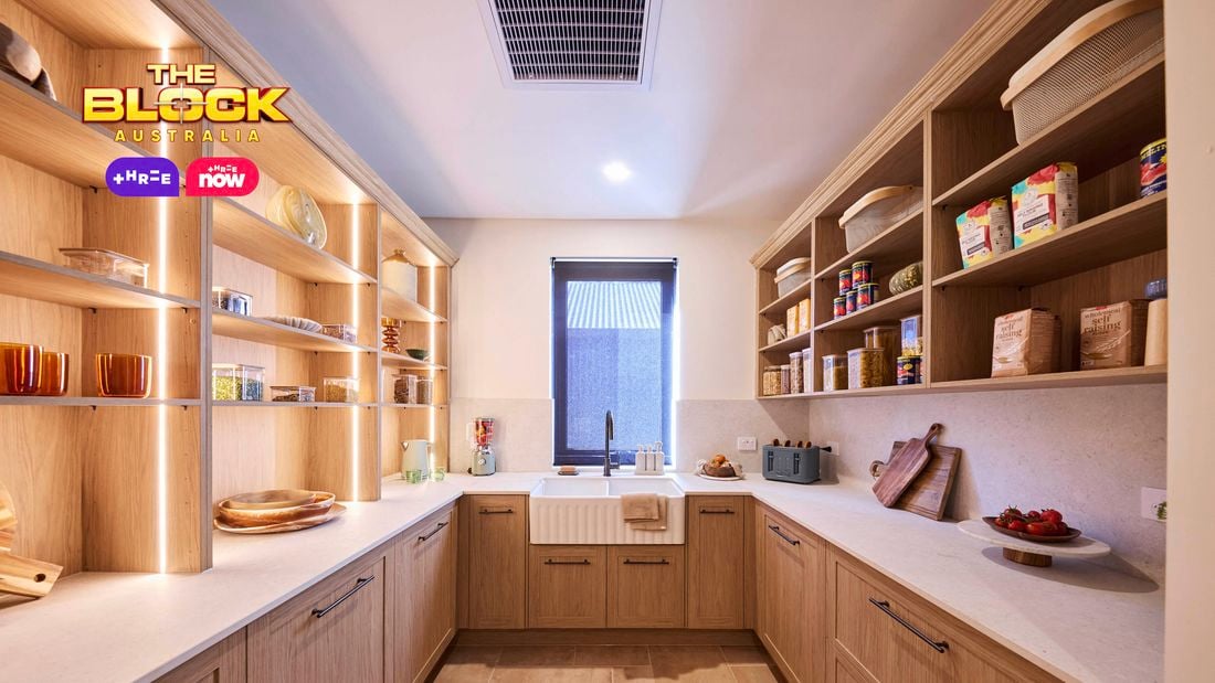 Butler’s pantry from The Block with timber cabinetry, open shelving, farmhouse sink, and stone benchtops.