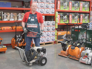 Bunnings team member holding a water blaster