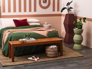 Bedroom with earthy tones and a geometric feature wall