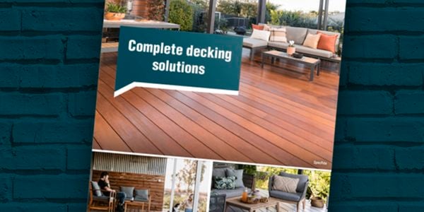 Decking booklet on green brick background.