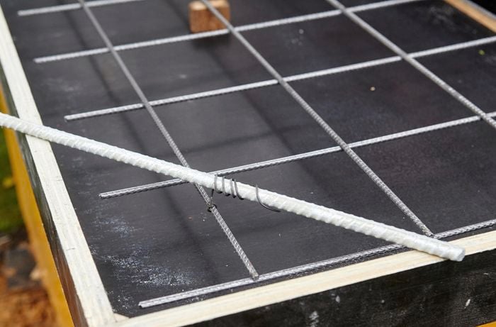Reinforcing mesh sitting on top of form ply frame.