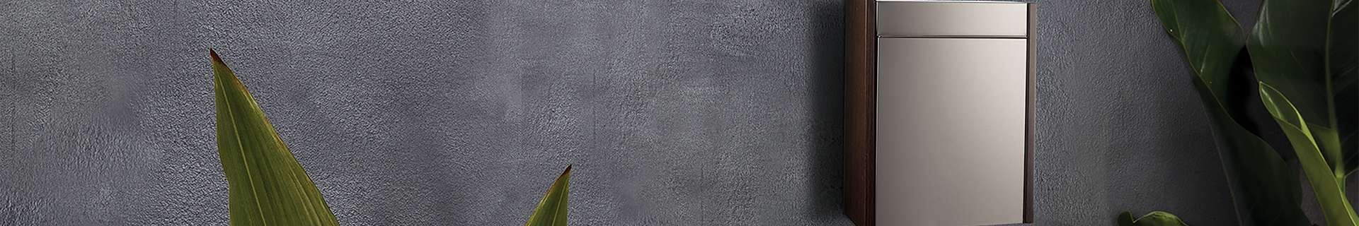 Metal letterbox on wall
