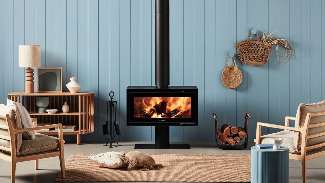Indoor wood heater in a styled living room.