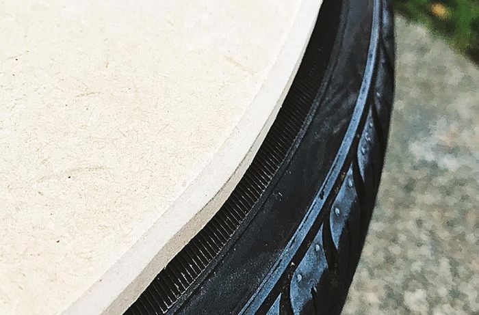 DIY ottoman made using tyre and a smoothed MDF board circle using a random orbital sander.
