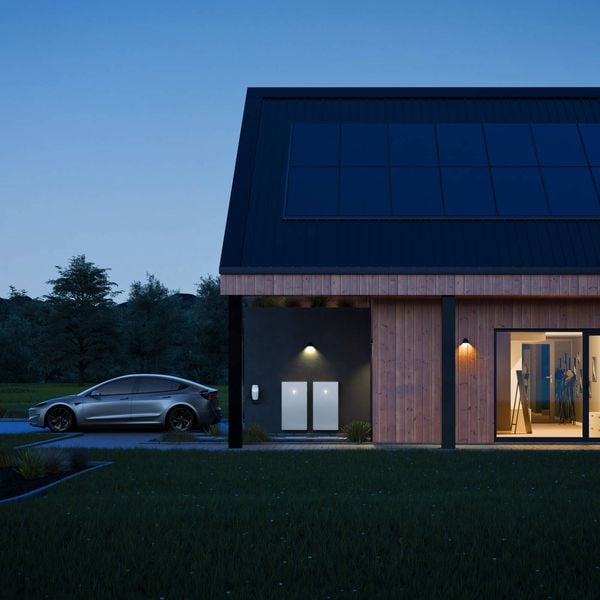 Tesla powerwall on house exterior.