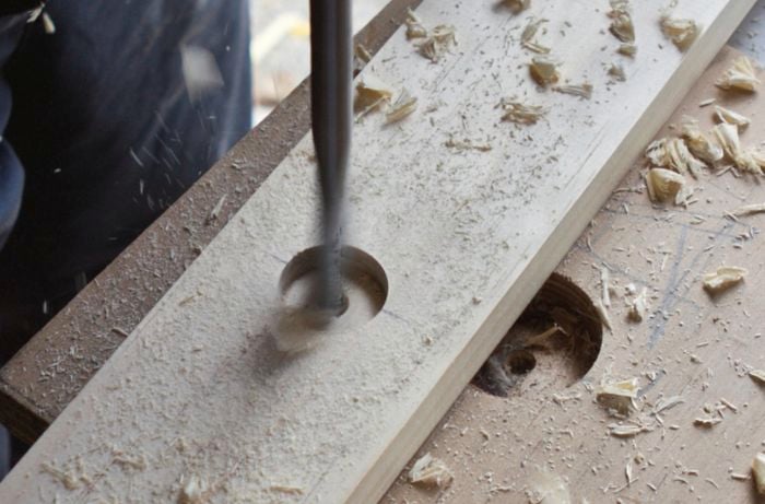 The uprights of a beach tent being made
