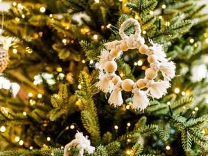 A macrame decoration on a Christmas tree
