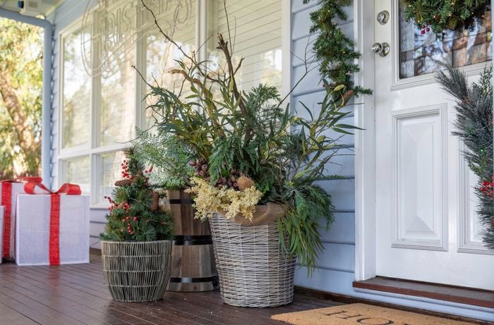 front door with plants and gifts