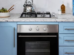 Kitchen with chrome oven.