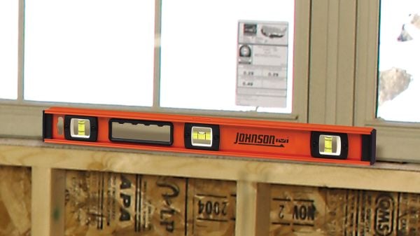 Person using box level to level timber