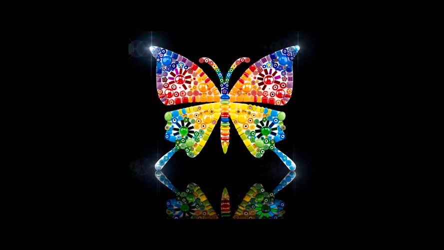 Brightly coloured mosaic butterfly made with an assortment of Mandala Art Mosaics glass tiles. 