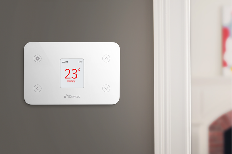 Digital thermostat attached to wall