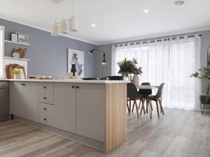 Renovated kitchen with a benchtop and painted laminate cabinets